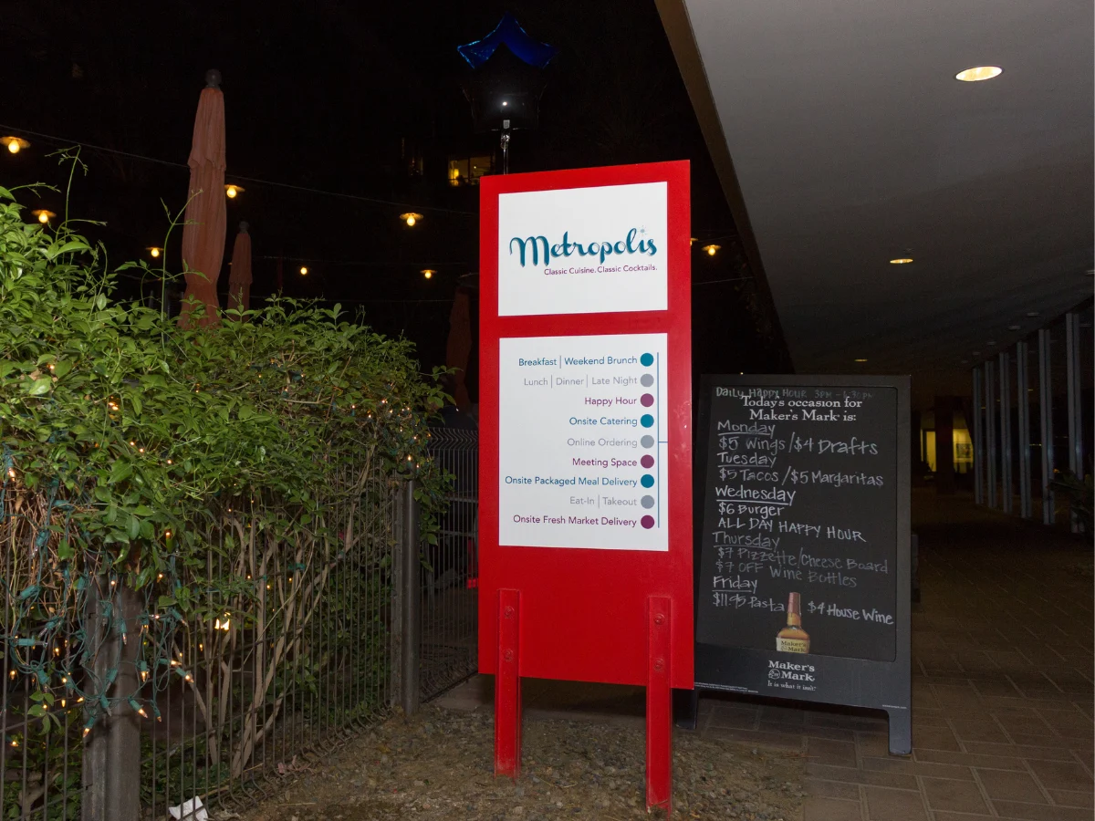 Metropolis exterior sign with daily happy hour specials